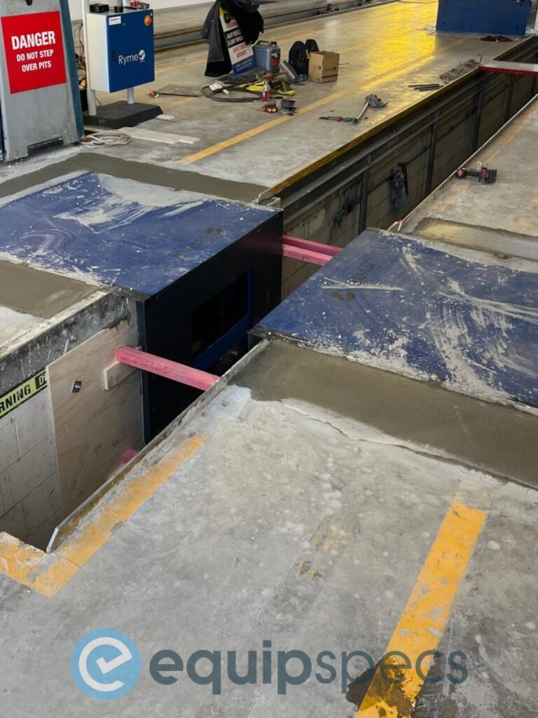 Concrete drying for a roller brake tester as part of a vehicle workshop upgrade. 