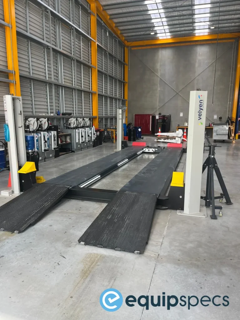 A close up of a retrofit LED light system on a Velyen Heavy Duty Four Post Lift completed by EquipSpecs. 