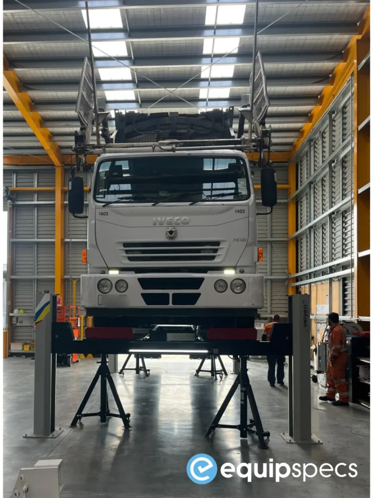 A front on image showing a truck up on a Velyen Heavy Duty Four Post Lift with retrofit LED lighting system installed by EquipSpecs. 