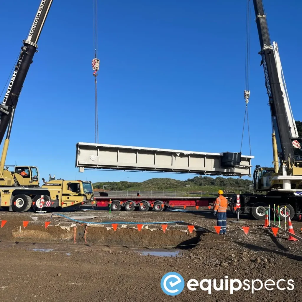 Crane lifting an EquipSpecs prefabricated steel inspection pit into place, demonstrating fast installation and minimal workshop downtime.