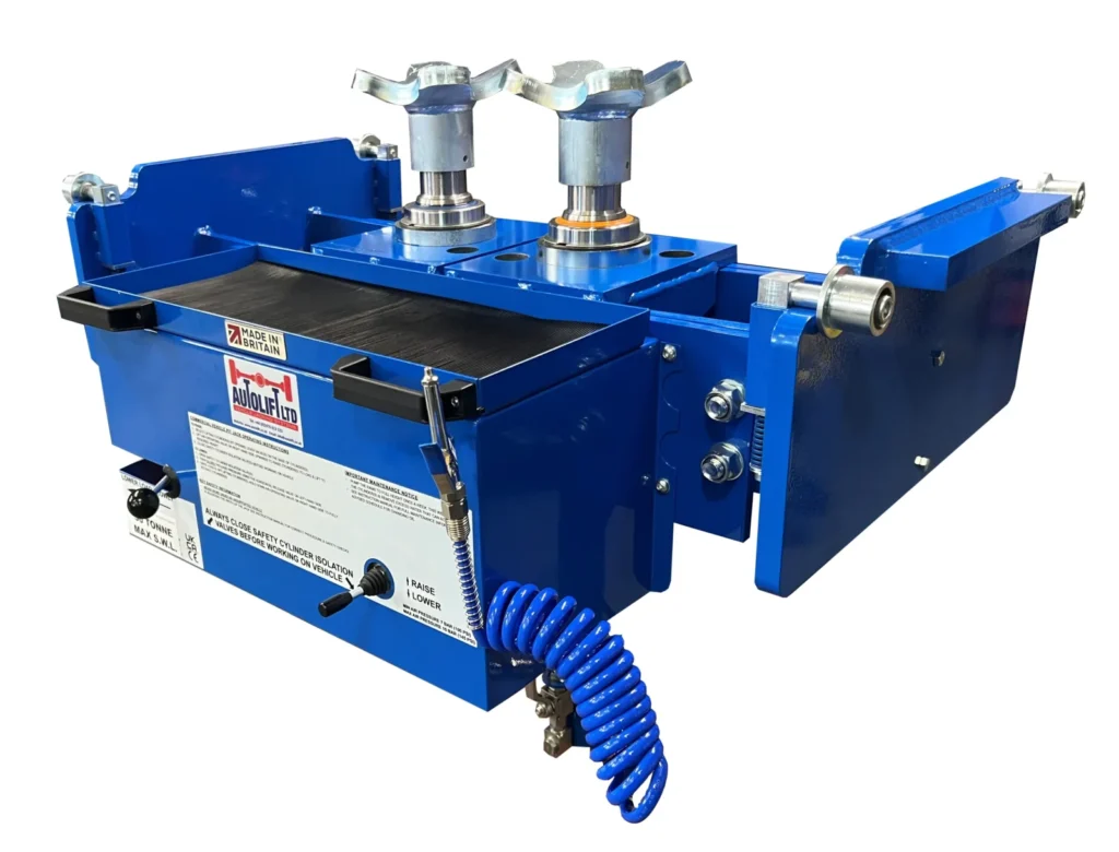 Autolift 30T twin ram pit jack for heavy vehicle workshops in New Zealand with air-over-hydraulic lifting and adjustable frame design.