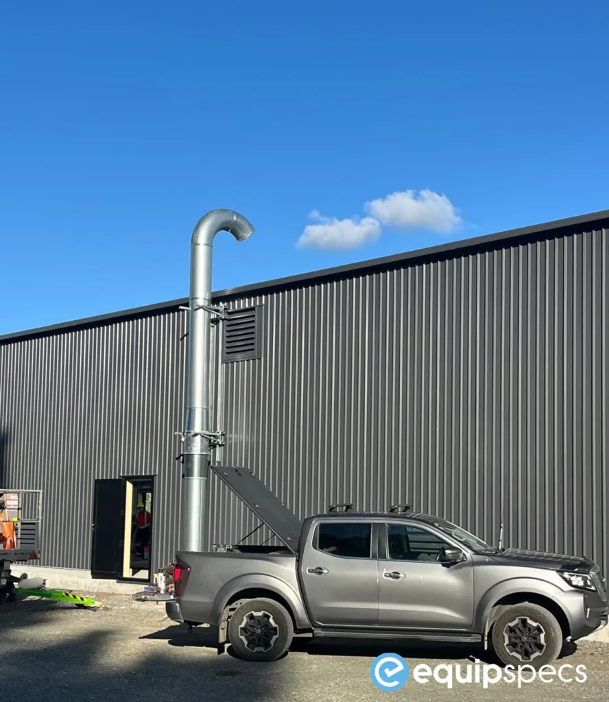 External heavy vehicle workshop pit ventilation stack installed by EquipSpecs beside a modern workshop building, designed to support controlled airflow and AS/NZ 60079-aligned pit ventilation compliance.External heavy vehicle workshop pit ventilation stack installed by EquipSpecs beside a modern workshop building, designed to support controlled airflow and AS/NZ 60079-aligned pit ventilation compliance.